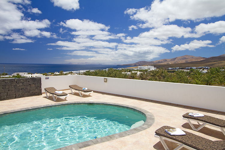 Relax by your private pool and soak up breathtaking ocean and mountain views