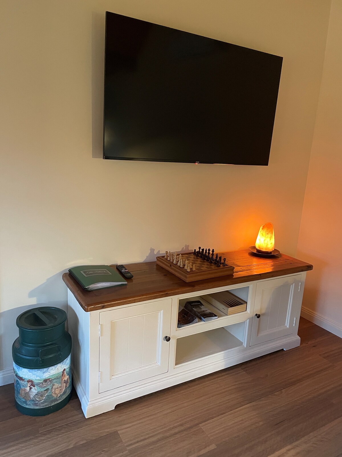 A smart tv ready for you to stream what ever you like, or leave it turned off and enjoy the peace and quiet!
There are also books, and a variety of games behind those cupboard doors.  You can take the books, but please enjoy and then leave the games.