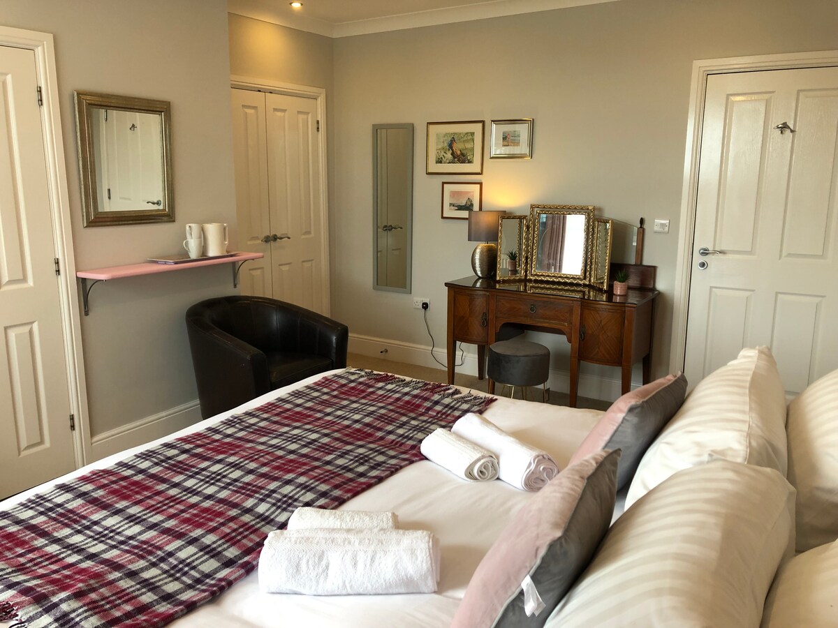 Dressing Table/Work Desk,  Tea and coffee making facilities, 1 easy chair, Large built-in closet.